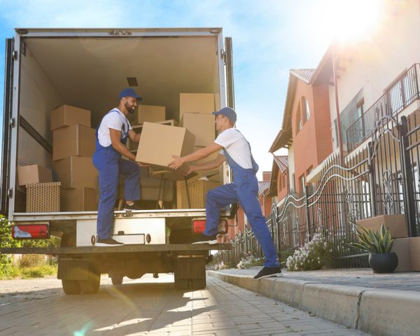 bigstock workers unloading boxes from v 433493816 (1)